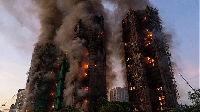Hong Kong charges seven people and two firms over massive fire that killed 168