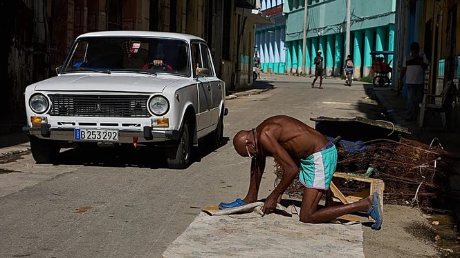 Cuban president announces economic reforms to 'liberalise' the embargo-hit and blockaded island