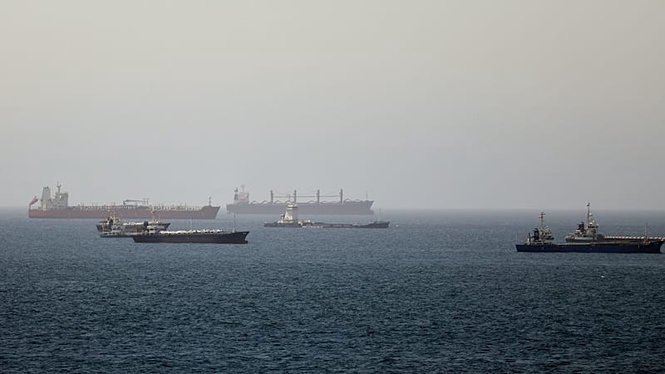 Oil tanker hit by 'unknown projectile' in Strait of Hormuz, British military says