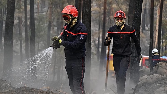 Wildfire in southern France under control, blaze rages on in Spain