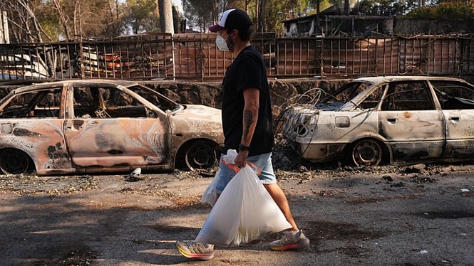 Evacuees return in Spain and French wildfires stabilise, though heatwave keeps authorities on alert