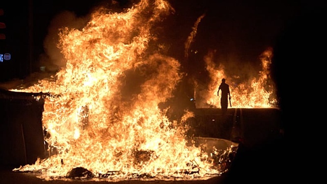 Barcelona housing protest erupts into clashes as barricades burn