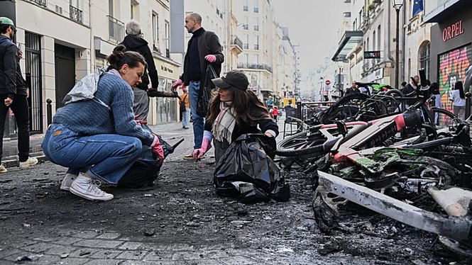Burnt bicycles, smashed windows and looted shops: Trail of destruction across Paris