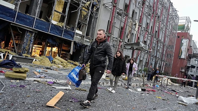 Russian drone attack kills two in Kyiv as residents survey damage