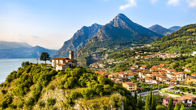 Image from: In Italy, this village famous for its olive groves offers incredible views of a lake and the lush mountains beyond