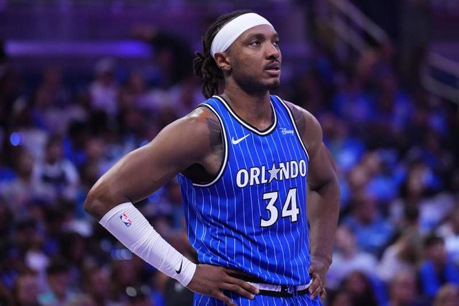 Image from: Magic center Wendell Carter Jr. turns heads courtside at Dream game with custom Angel Reese jersey