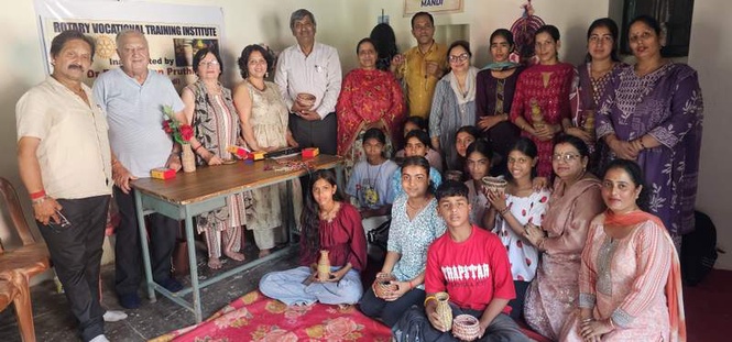 Image from: Rotary Club trains students in pine needle craft during summer camp