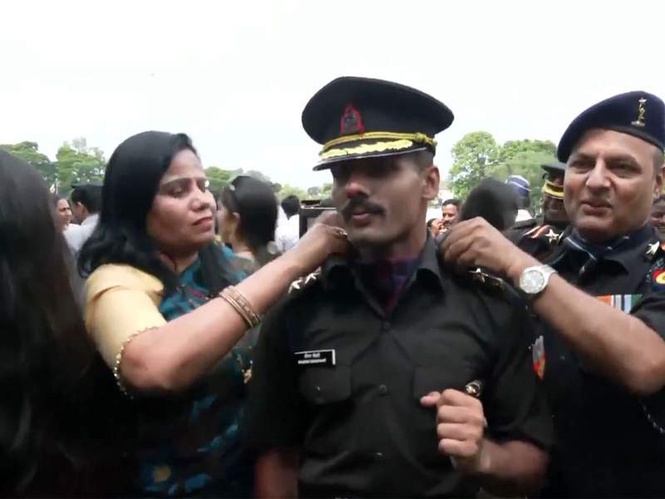 Image from: Military cadets share inspiration; parents adorn shoulders with stars at pipping ceremony