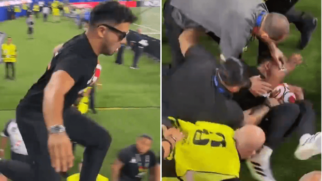 Image from: 'The worst streaker in history of sport' gets taken out by security second after stepping on pitch