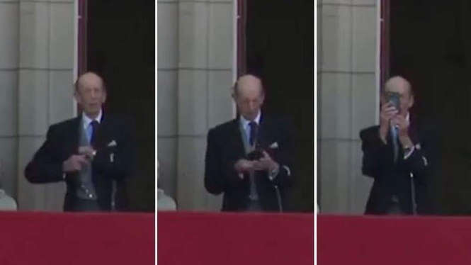 Image from: Duke of Kent, 90, uses phone while on Buckingham Palace balcony to record RAF flypast