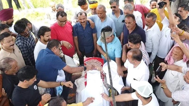 Image from: Tears & tributes as sailor cremated in native village