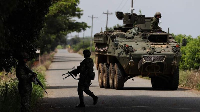 Image from: Colombia sees new peace breakthrough as 100 rebels hand over arms