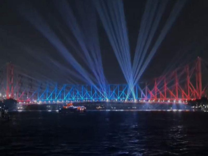 Image from: Howrah Bridge lights up ahead of International Yoga Day celebrations in Kolkata