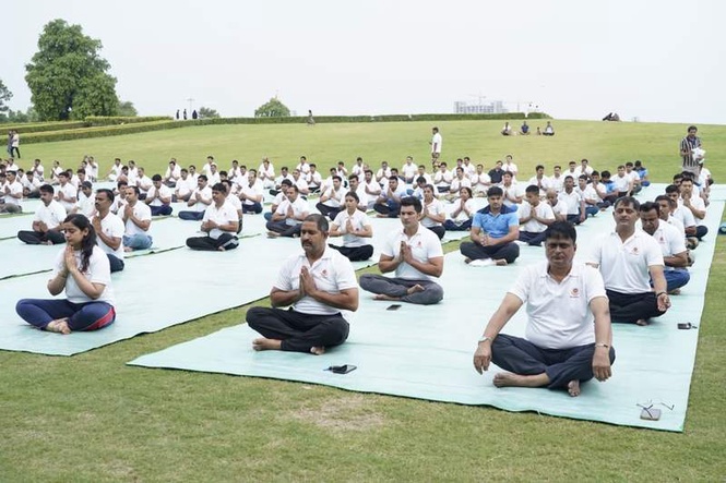 Image from: Delhi Police, CISF mark International Yoga Day at Rajghat
