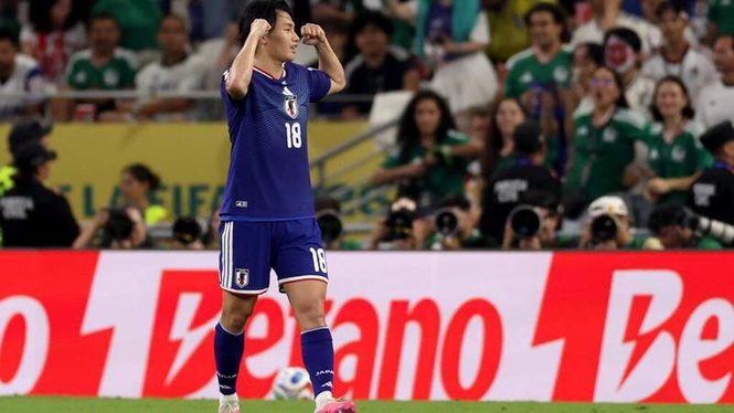 Image from: Ueda shines as Japan knocks out Tunisia in World Cup's 1,000th game