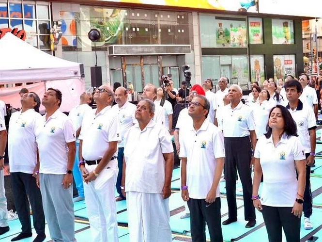 Image from: US: Om’ resonates at Times Square as yogis celebrate International Day of Yoga
