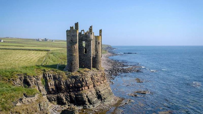 Image from: In the UK, perched on Scotland’s wild northern cliffs, this dramatic castle is slowly being claimed by the sea (you’ll have to hurry to see it!)