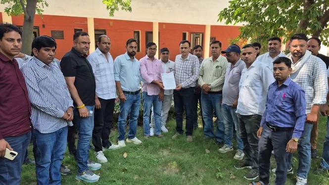 Image from: Veterinary staff protest attack on official, demand strict action against accused farmer