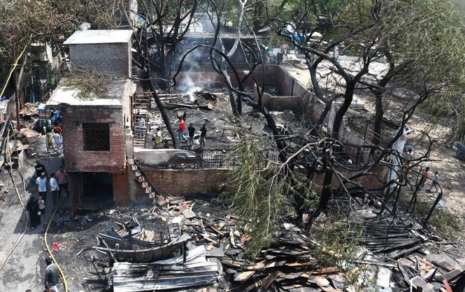 Image from: Malhotra visits Delhi Gate fire victims, assures assistance