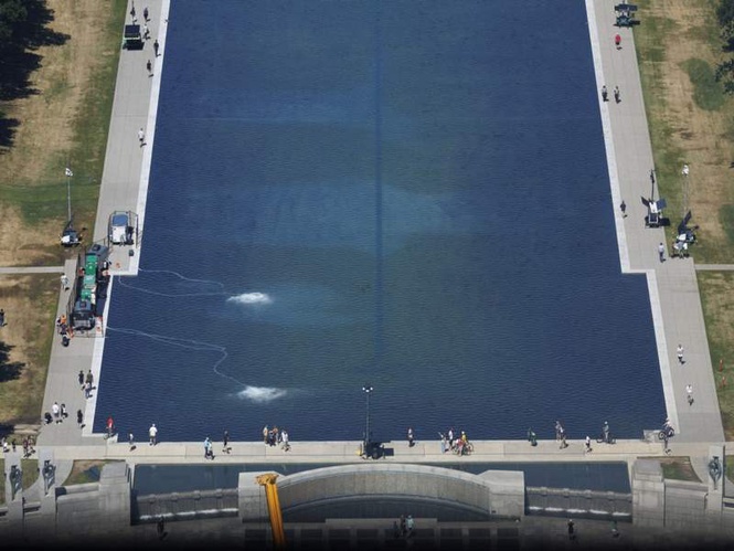 Image from: From American flag-blue to algae green, Trump says reflecting pool is now in “good shape”