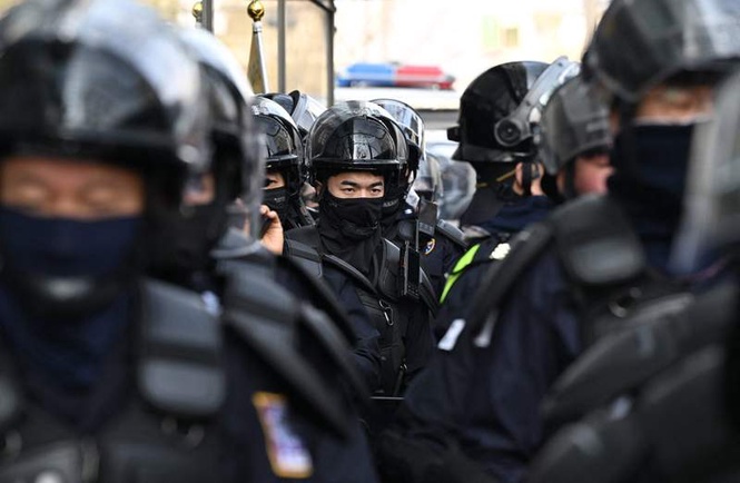 Image from: Riot police deployed at airport to protect World Cup manager after death threat