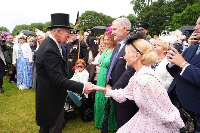 Image from: King and Queen meet Scottish footballing legend at Holyroodhouse garden party