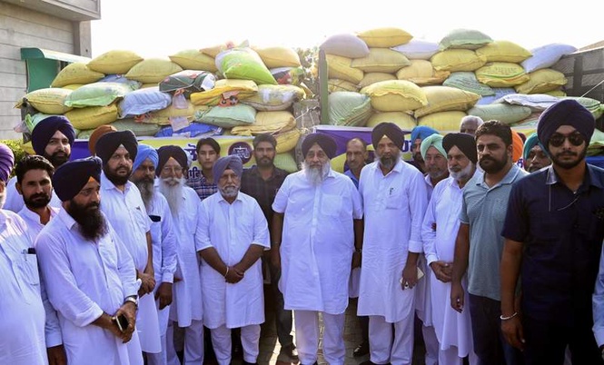Image from: Sukhbir Badal launches wheat relief drive for rain-hit farmers in Malout