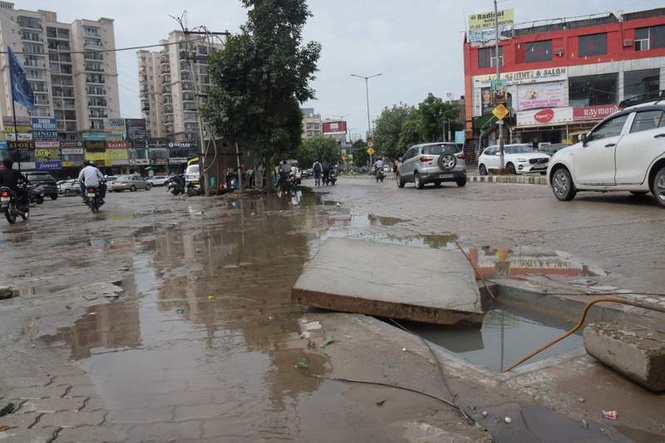 Image from: Manholes & potholes : Safe roads and drains require accountability