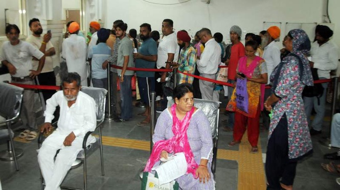 Image from: Women queue up at Seva Kendras after first welfare scheme payment