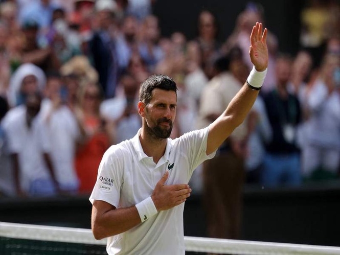 Image from: Wimbledon: Novak Djokovic breaks Roger Federer's singles wins record, advances to QFs