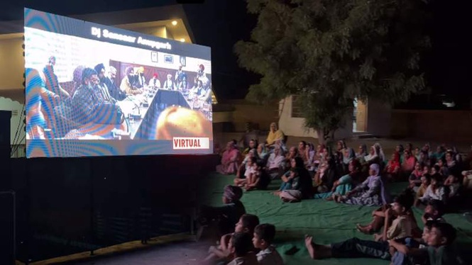 Image from: ’Satluj’ ban couldn’t stop Rajasthan: Villagers gather for massive big-screen screening