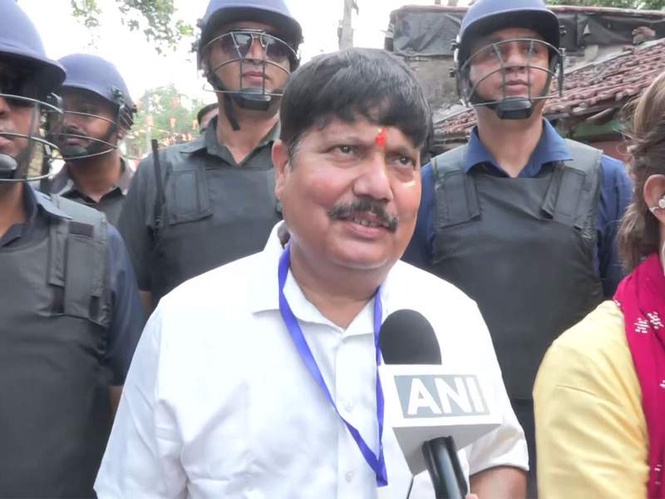 Image from: WB polls: BJP leader Arjun Singh alleges TMC placed 'false dummy EVM' outside booth in Mayapally