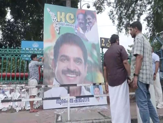 Image from: CPI(M) worker caught on CCTV installing pro-KC Venugopal flex in Thrissur; UDF alleges conspiracy