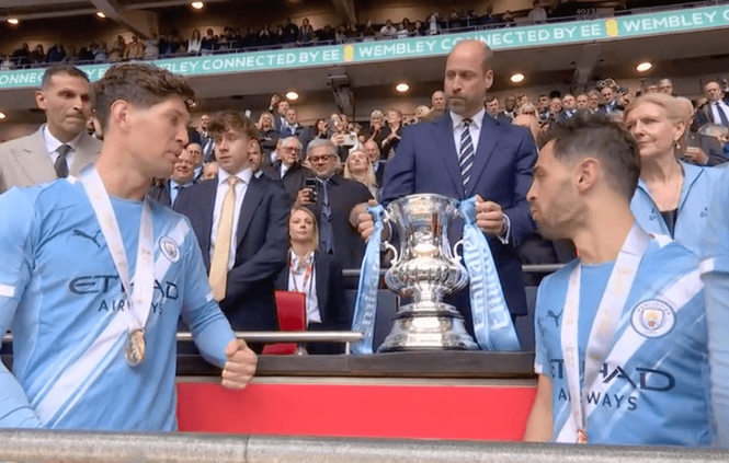 Image from: Prince William presents FA Cup trophy to iconic Manchester City duo in heartwarming moment