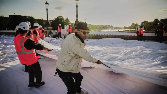 Image from: ‘French Banksy’ JR wraps Paris’s Pont Neuf bridge in inflatable ‘cave’