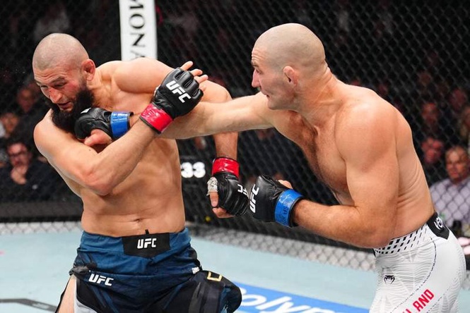 Image from: Khamzat Chimaev reacts with training post after Sean Strickland defeat highlighted weakness