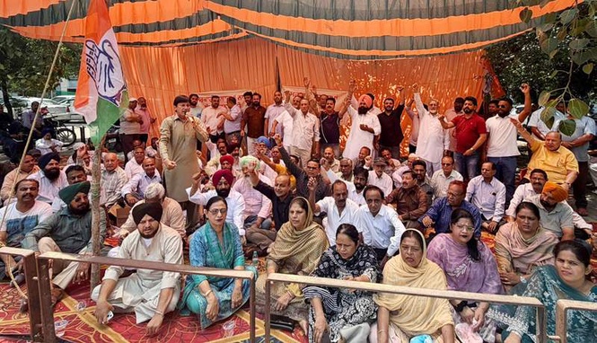 Image from: Cong leaders raise slogans in Jalandhar, ask govt to release staff DA