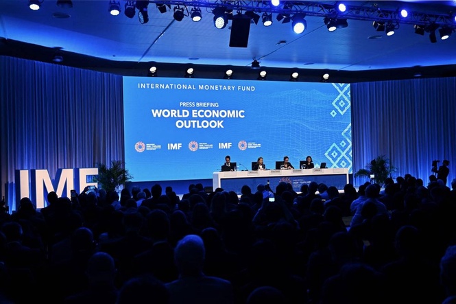 IMF raises its forecast for world growth this year but warns of risks from AI boom and debt
