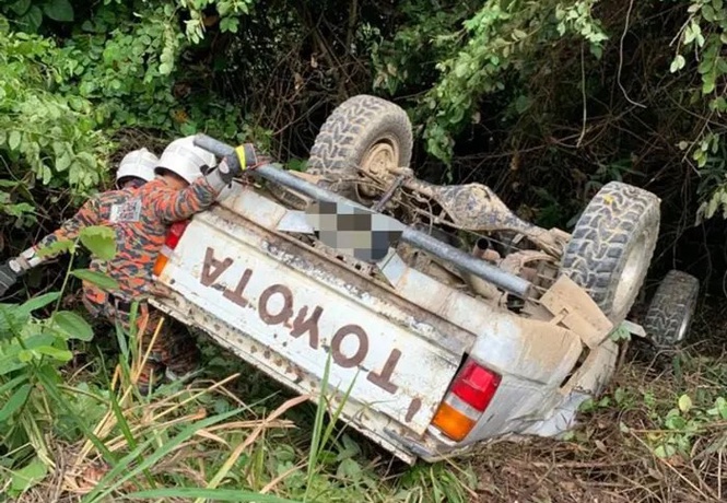 Woman killed, seven injured after four-wheel drive plunges into ravine in Keningau