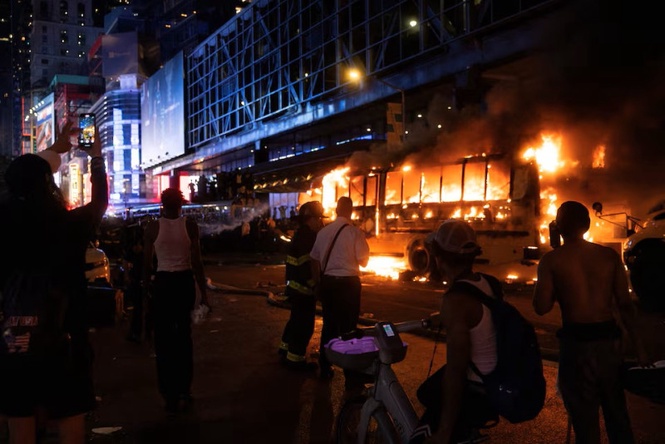 World Cup bus torched as Knicks title celebrations descend into chaos in Manhattan