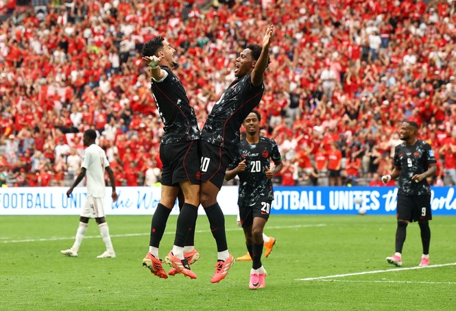 Canada crush nine-man Qatar for first World Cup victory