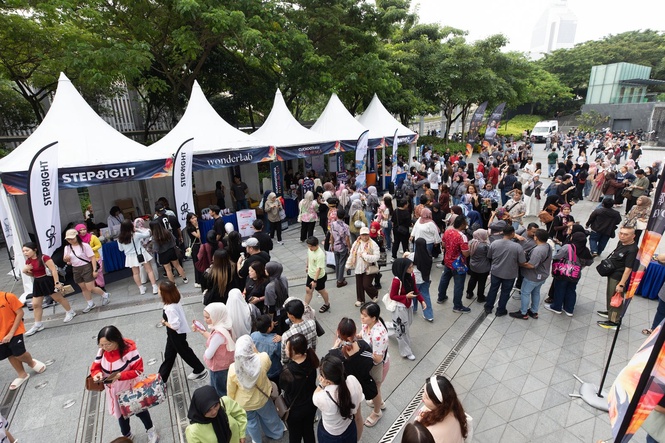 Fans gather at partner booths outside Stadium Merdeka before CUCKOOTOPIA
