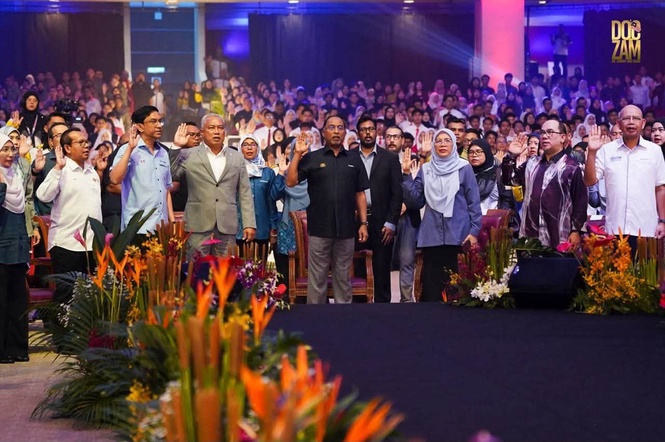 May be an image of one or more people, crowd and text