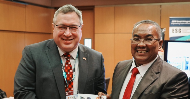 May be an image of newsroom and text