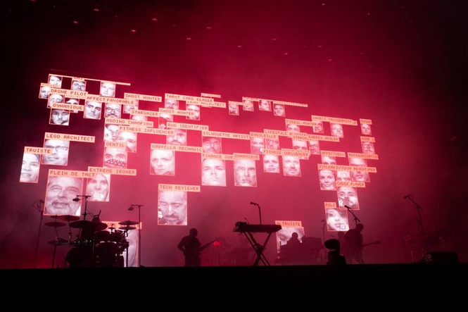 Image from: Massive Attack banned from Singapore over Palestinian flag display