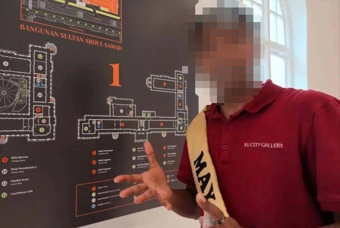 Image from: Was the sashed foreign staffer at Sultan Abdul Samad Building really a tour guide?