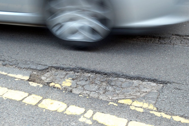 Government pledges to get tough on UK councils over pothole failures
