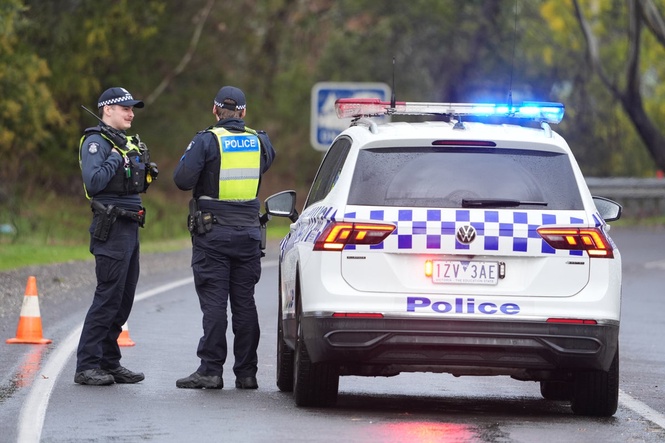 Man charged with murder of wife and two sons after calling police to their home in Australia