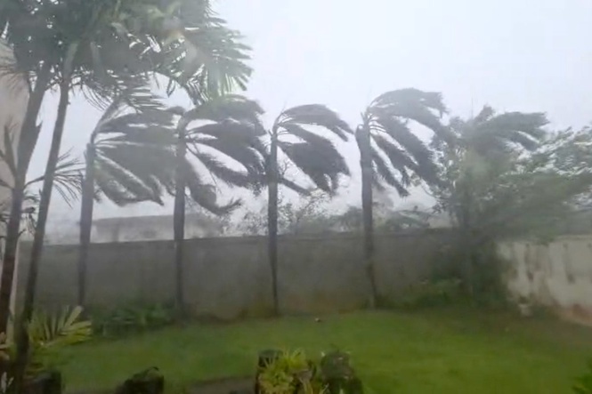 Flying tree limbs, collapsed buildings as major typhoon in Pacific bears down on remote US islands