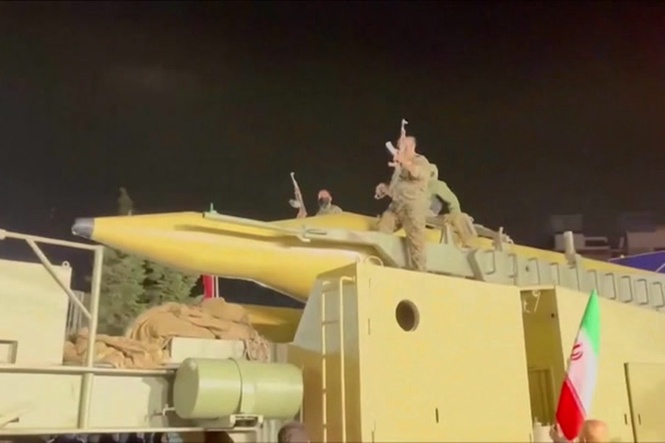 Iran shows off what appears to be a ballistic missile at Tehran rally